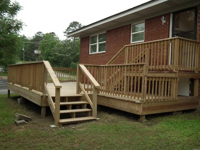 back of property featuring a wooden deck