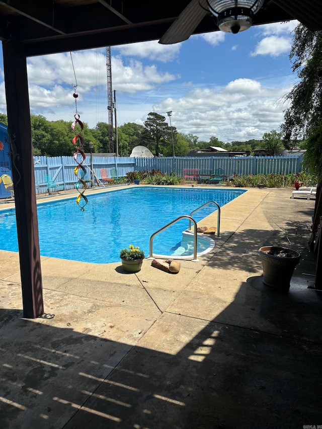 view of swimming pool with a patio area