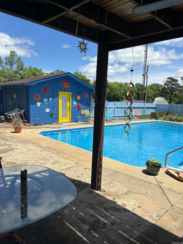 view of swimming pool featuring a patio area