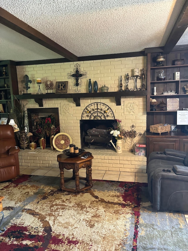 living room featuring brick wall, a brick fireplace, beamed ceiling, and a textured ceiling