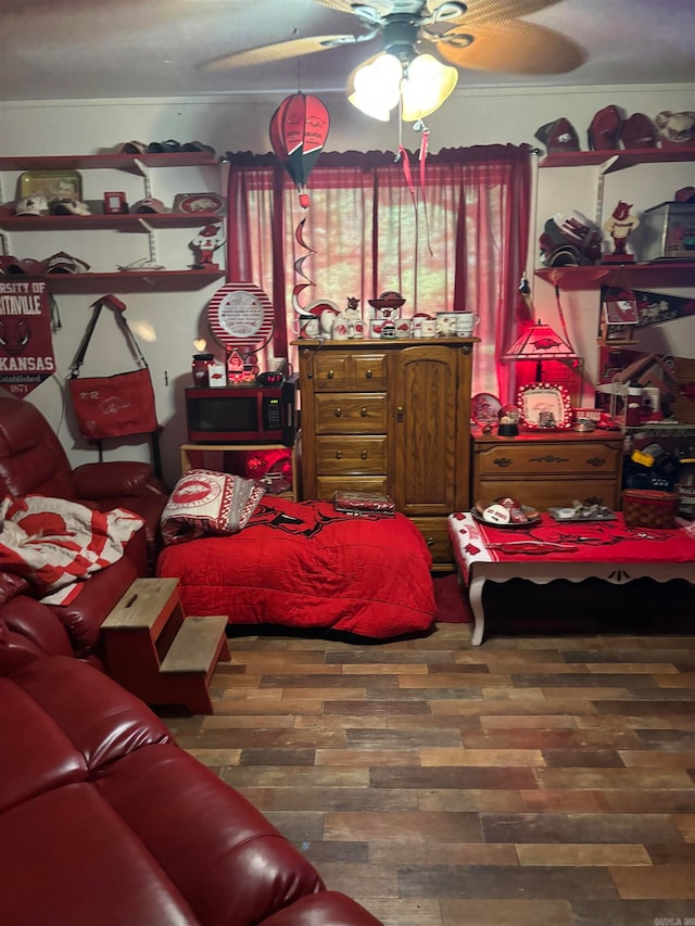 bedroom with wood-type flooring and ceiling fan