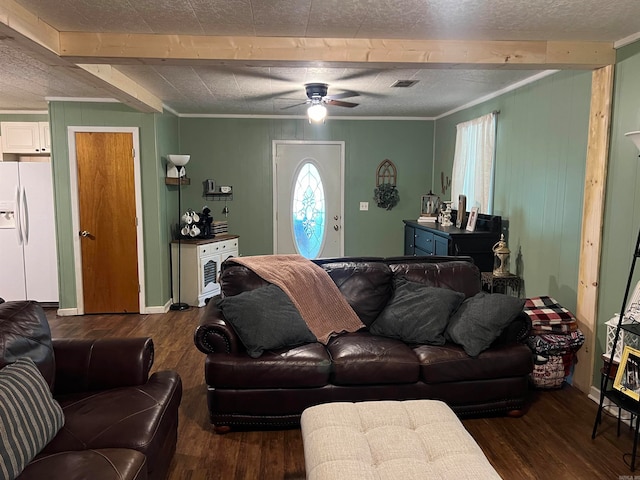 living room featuring hardwood / wood-style flooring, beam ceiling, ceiling fan, and a textured ceiling