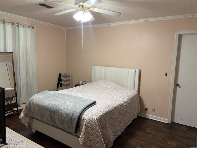 bedroom with ceiling fan, crown molding, and dark hardwood / wood-style floors