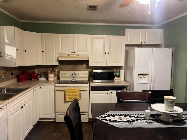 kitchen featuring ornamental molding, white cabinets, white appliances, and sink