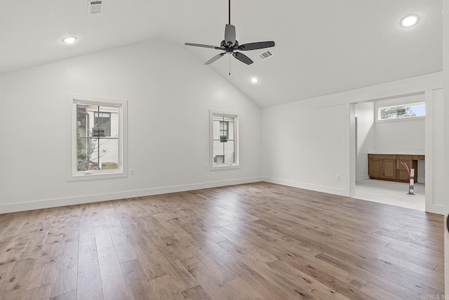 additional living space featuring wood-type flooring, high vaulted ceiling, and ceiling fan