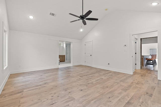 unfurnished living room featuring light hardwood / wood-style flooring, high vaulted ceiling, and ceiling fan