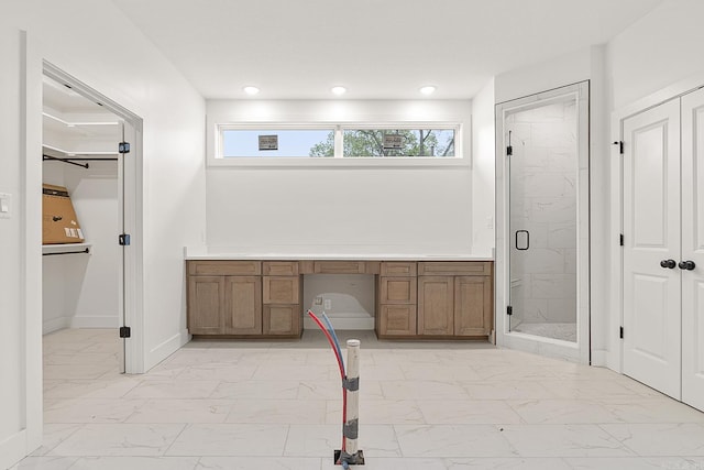 bathroom featuring a shower with door and tile patterned flooring