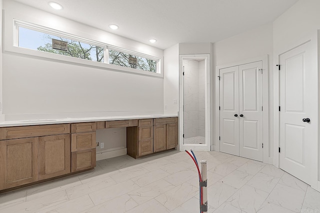 interior space with vanity, tile patterned floors, and a healthy amount of sunlight