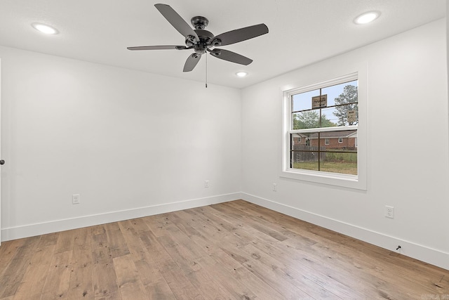 unfurnished room with ceiling fan and light hardwood / wood-style floors