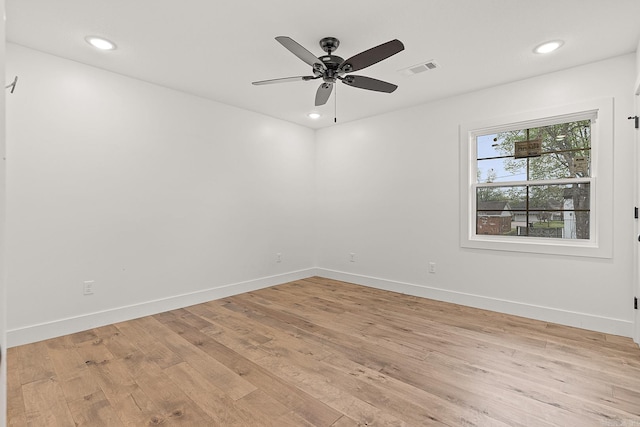 unfurnished room with ceiling fan and light hardwood / wood-style flooring