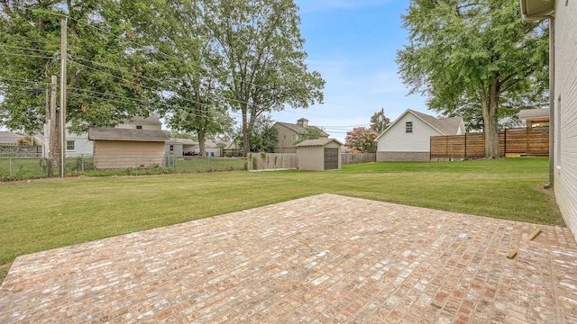 view of yard with a patio area and a shed