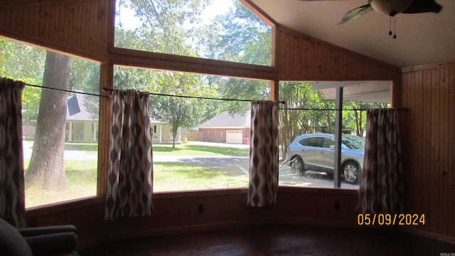 interior space with lofted ceiling and ceiling fan