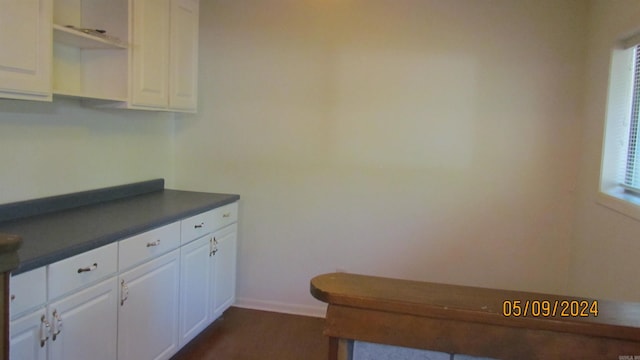 kitchen featuring white cabinets and a healthy amount of sunlight