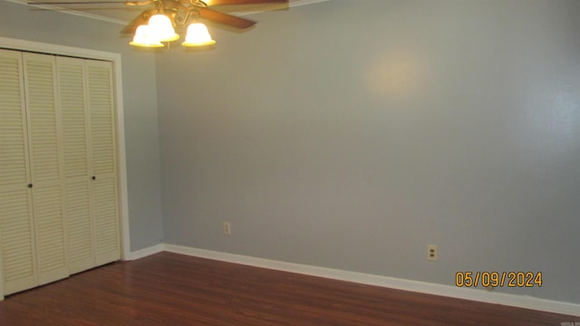 unfurnished bedroom featuring a closet, hardwood / wood-style floors, and ceiling fan