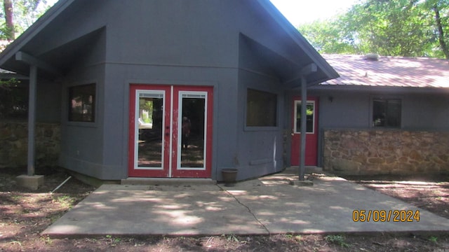 doorway to property featuring a patio area