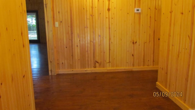 empty room with dark hardwood / wood-style floors