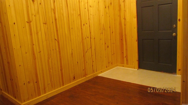 unfurnished room with wood-type flooring