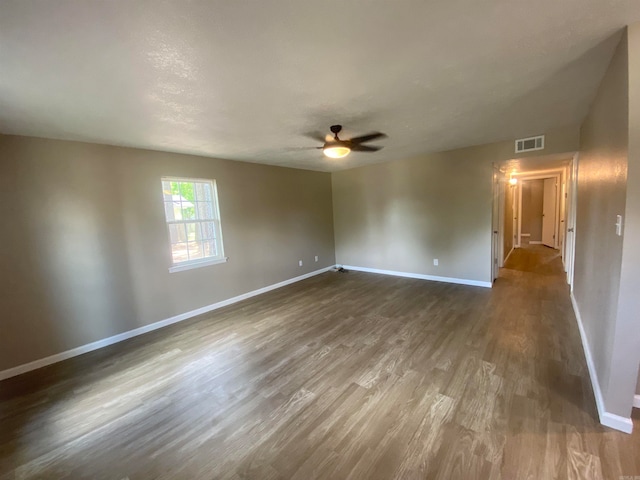 spare room featuring ceiling fan and hardwood / wood-style floors