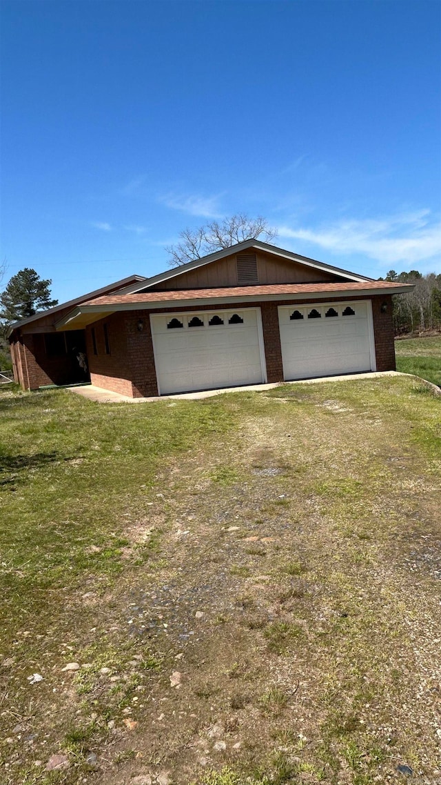 view of front of house with a front yard and a garage