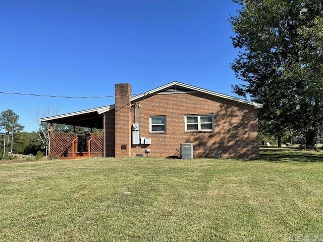 view of property exterior featuring cooling unit and a yard