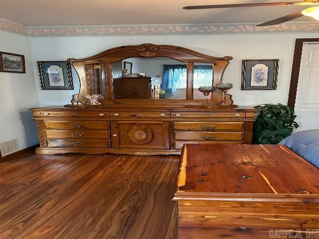 bedroom featuring dark wood-type flooring and ceiling fan