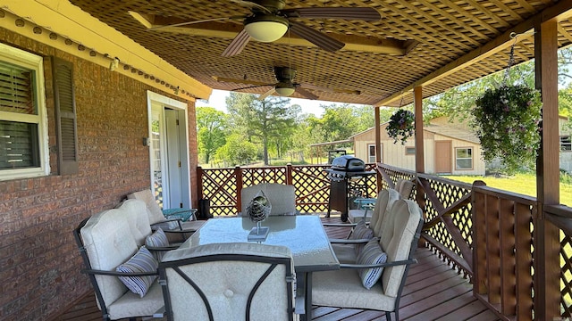 wooden terrace with a grill