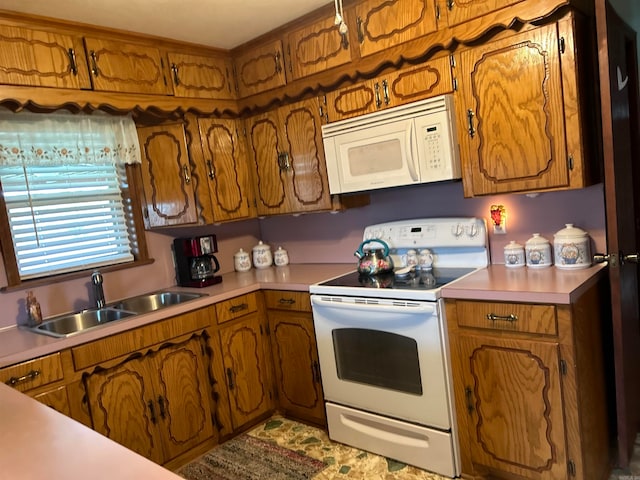 kitchen with sink and white appliances