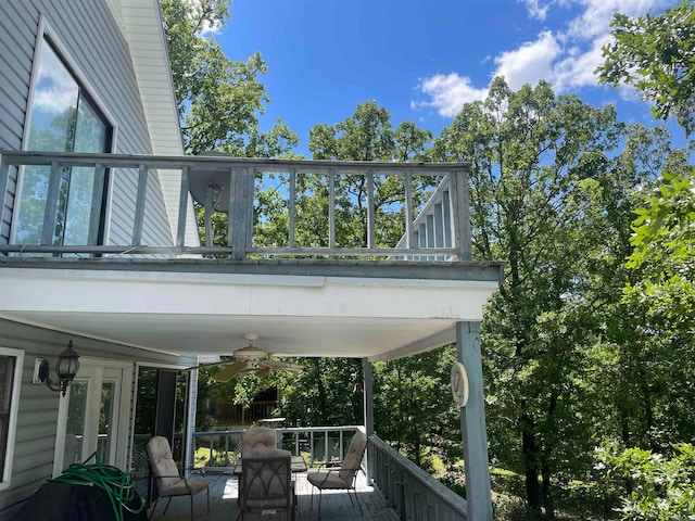 exterior space featuring ceiling fan