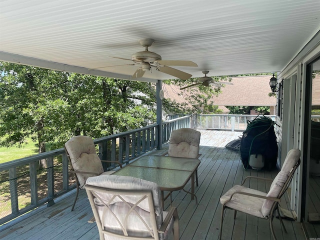 wooden terrace featuring ceiling fan