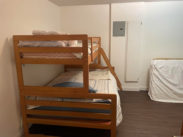 bedroom featuring dark wood-type flooring