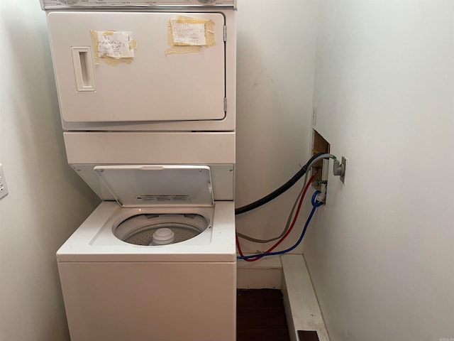 laundry room featuring stacked washer / dryer and washer hookup