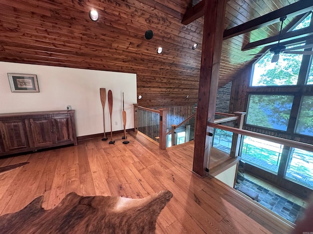 corridor featuring wood-type flooring, high vaulted ceiling, and wooden ceiling