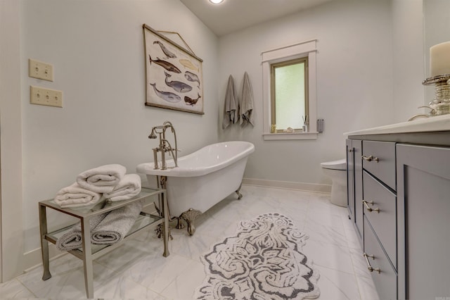 bathroom featuring tile flooring, vanity, and toilet