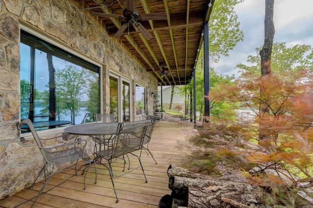 wooden terrace featuring ceiling fan