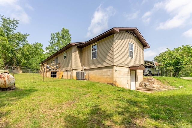 view of side of property with a lawn