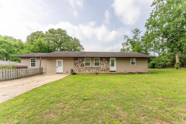 ranch-style home with a front lawn