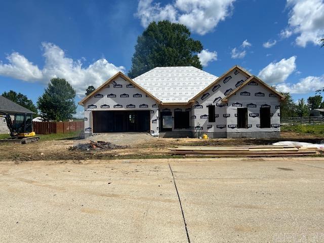 unfinished property featuring a garage