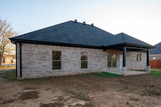 back of property featuring a patio area