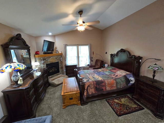 bedroom featuring a fireplace, carpet, lofted ceiling, and ceiling fan