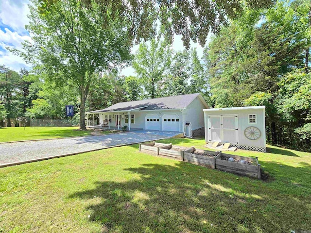 view of front facade with a front lawn and a storage shed