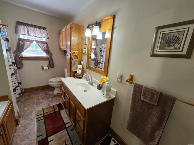 bathroom featuring tile flooring, toilet, and vanity