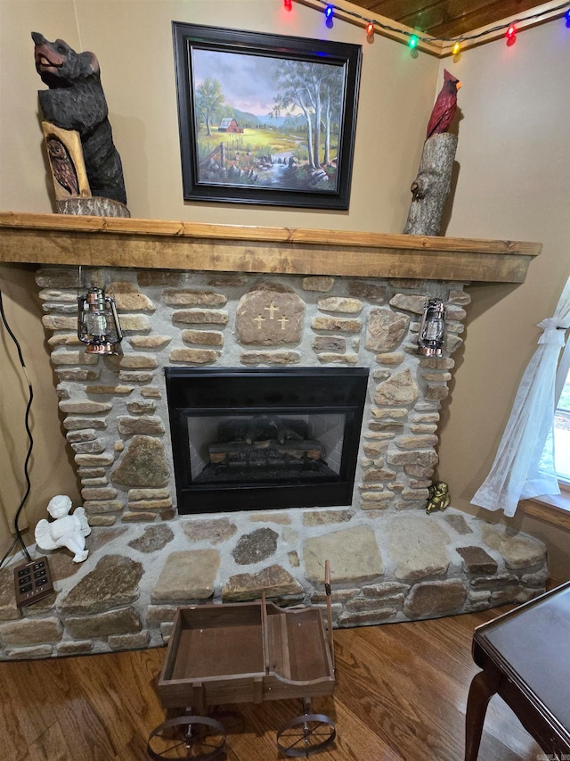 interior details with hardwood / wood-style floors and a fireplace