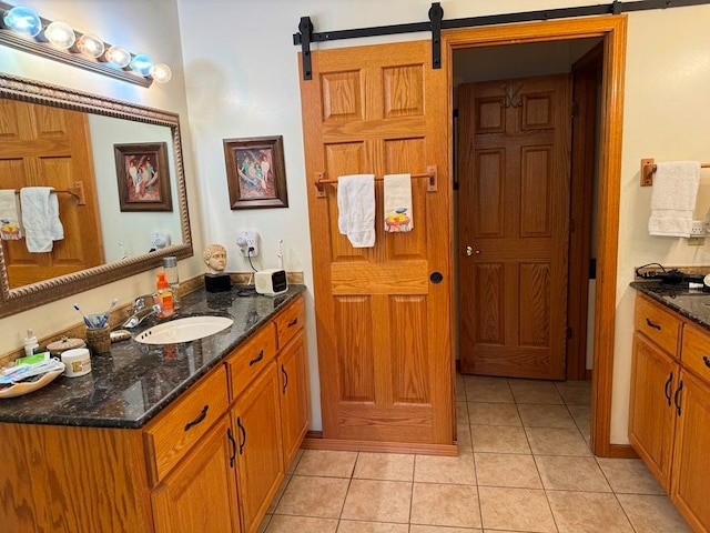 bathroom featuring tile floors and large vanity