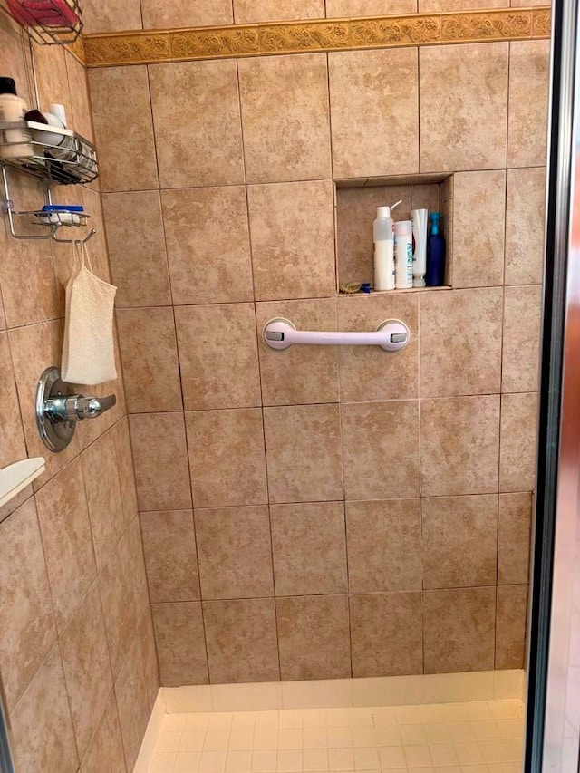 bathroom with tiled shower