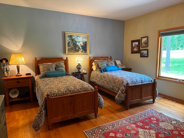 bedroom featuring wood-type flooring