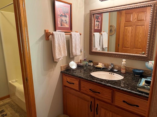 bathroom featuring tile floors and vanity