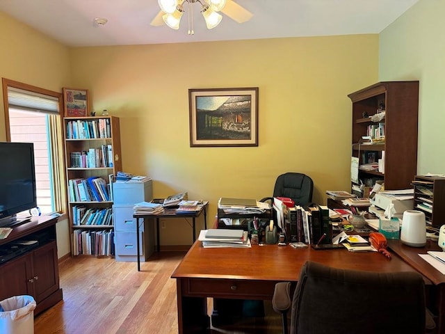 office space with light wood-type flooring and ceiling fan