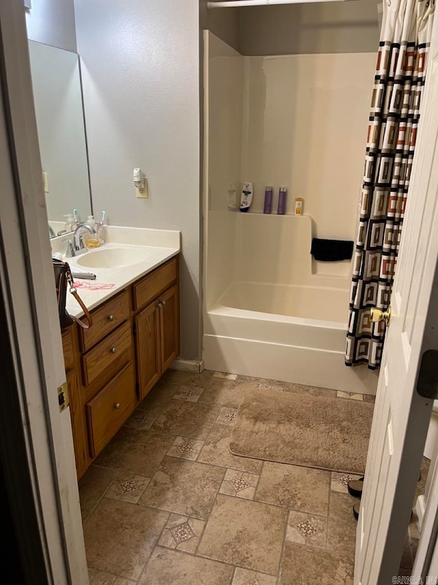 bathroom with vanity and  shower combination