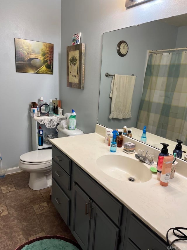 bathroom with toilet and vanity