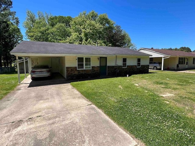 ranch-style house with a carport and a front lawn